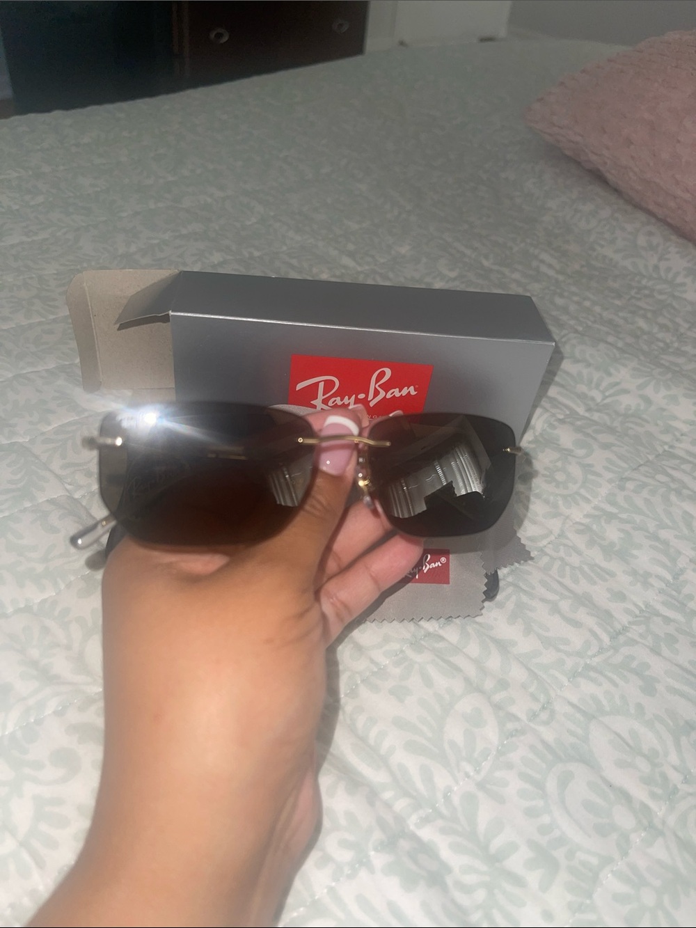 Ray-Ban woman’s dark brown lens aviator gold rim sunglasses